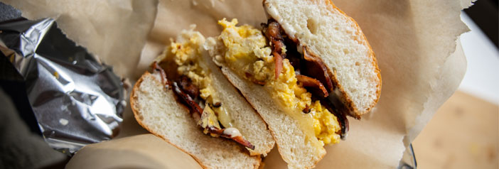 fresh bacon egg and cheese breakfast sandwich cross cut