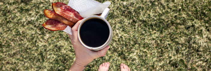cup of black coffee and perfectly cooked bacon in hand, barefoot in the backyard