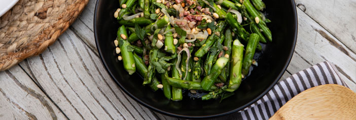 fresh, bright asparagus and crispy organic pancetta topped with roasted pine nuts and sautéed shallots
