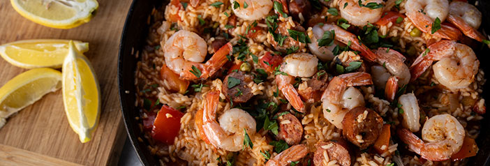grilled paella with andouille sausage in roasting pan on grill, North Country Smokehouse